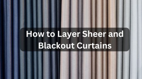 Layered sheer and blackout curtains hanging on a window